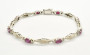 forma de rombo con rubies y brillantes